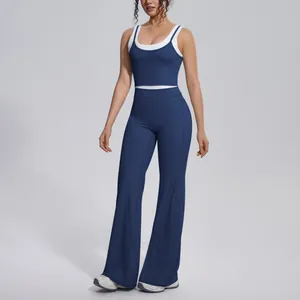 Two-piece navy blue yoga set with contrast white trim and high waist flared pants