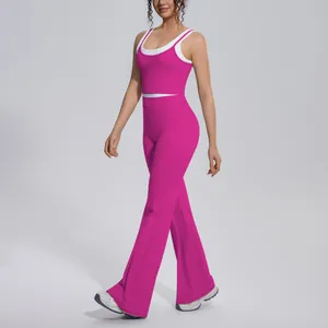 Professional view of a vibrant hot pink ribbed yoga set with high-waisted flared pants