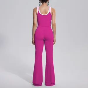 Back view of a fuchsia ribbed yoga set featuring a tank top and flared high-waisted pants