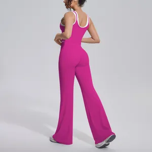 Detailed view of pink ribbed yoga set featuring high waist flared pants and racerback top.