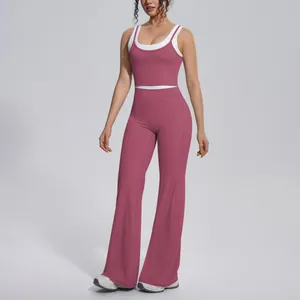 Detailed view of a mauve and white color-block yoga set with high-waisted flared leggings