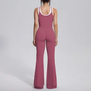 Back view of dusty rose ribbed high waist yoga set with flared pants and contrast top