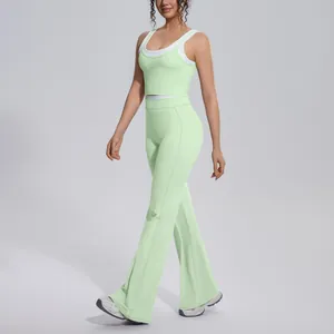 Close-up of high-waist flared yoga pants and sports top in lime green and white