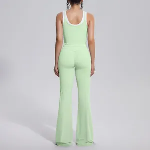 Back view of light green contrast yoga set with high waisted flared leggings