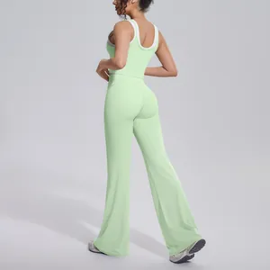 Detailed back view of a light green ribbed high waist yoga set with flared leggings