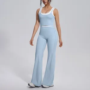 Full view of light blue color-blocking yoga set with high-waist flared pants on a model.