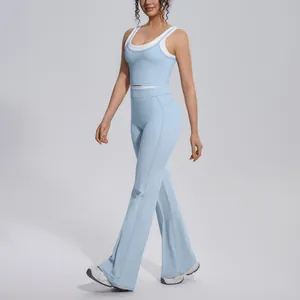 High-waist light blue color-block ribbed yoga set with flared sports pants shown on a model.