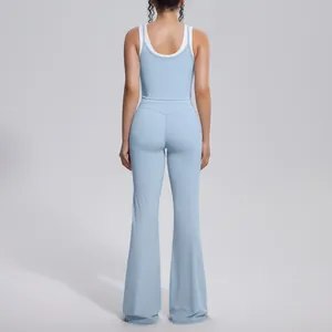 Back view of light blue high-waist flared yoga pants and matching sport tank top set