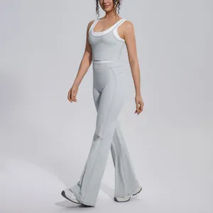 Detailed view of light gray yoga set with flared pants and sports crop top