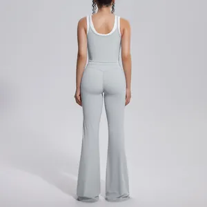 Back view of light grey ribbed yoga set featuring high waist flared pants for fitness