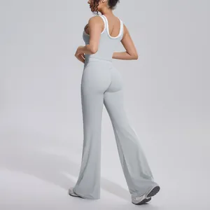 Professional back view of a grey contrast yoga set featuring high-waist flared pants.