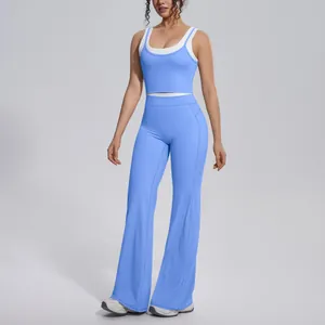 Detail of light blue two-piece yoga set with high waist flared pants and tank top