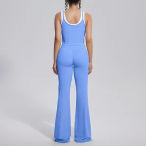Detailed back view of a blue two-piece yoga set featuring contrast straps and flare pants