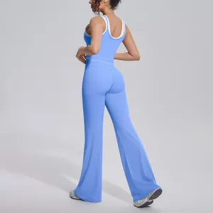 Back view of light blue high-waisted flare yoga pants and matching sports tank top