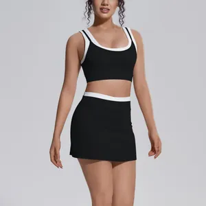 Detail view of black ribbed yoga set with white contrasting trim