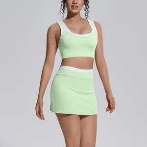 Front view of mint green contrast yoga set with high waist skirt and sports bra