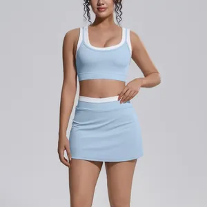 Close-up of light blue and white color-blocking athletic yoga set with ribbed details