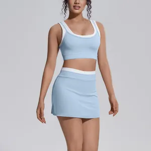 Close-up detail of light blue color-blocking yoga set with ribbed texture and high-waist skirt