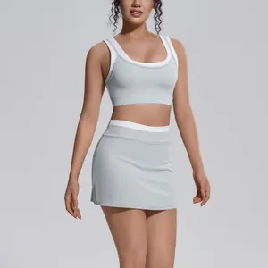 Close-up detail view of professional light grey ribbed yoga set with white contrast trim edges