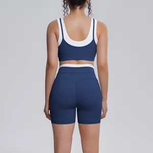 Back view of navy blue and white color-block ribbed high-waisted athletic yoga set