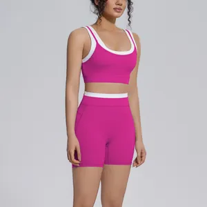 High-waisted magenta yoga set with white contrast trim on sports bra and shorts