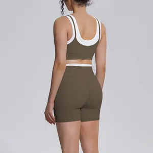 Back view of olive green and white contrast ribbed yoga set with high waist shorts