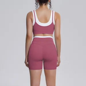 Back view of professional ribbed yoga set with contrast white trim in dusty rose