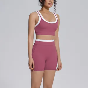 Detail showing the contrast waistband and mauve fabric of this high-waisted yoga set