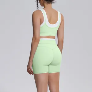 Back view of mint green and white contrast yoga set with ribbed high-waist shorts