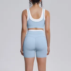 Back view of light blue color-block high-waisted yoga bra and shorts set for fitness