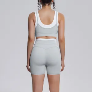 Back view of grey and white rib-knit high-waist yoga set with sports bra and shorts.