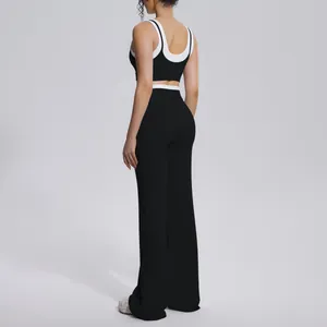 Back view of black and white contrast ribbed yoga set with high waist wide-leg pants