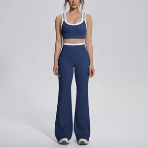 Front view of navy blue and white contrast yoga set with high-waisted flared pants