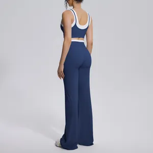 Rear view detail of navy blue and white contrast high-waisted yoga set on model