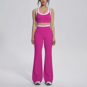 Detail view of pink contrast color yoga set featuring flared sports pants and top