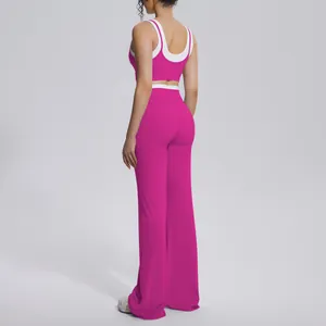 Back view of fuchsia yoga set featuring contrast trim top and wide-leg trousers