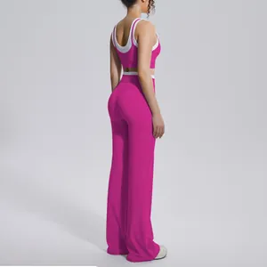 Detailed view of fuchsia color-block yoga set with high-waist flared pants.