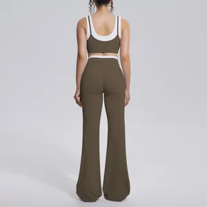 Back view of a professional brown and white color-contrast ribbed high-waist yoga set