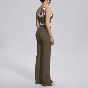 Side view detail showing the high-waisted flared pants and ribbed yoga top in brown