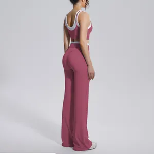 Side view of rose red yoga set with color-blocking bra and high waist flared pants