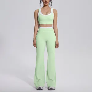 Professional front view of mint green contrast yoga set with sports bra and flared pants