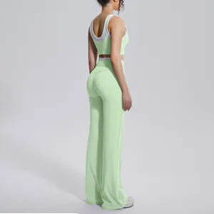 Side view of mint green high-waist wide-leg yoga pants and matching sports bra set.