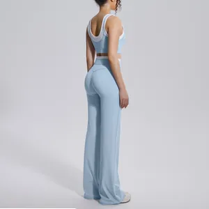 Full side profile of a light blue high-waist flared yoga pant and matching sports bra set.
