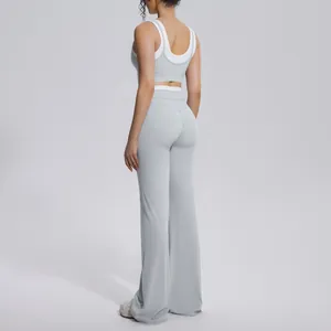 Rear view of light grey ribbed high-waist flared yoga pants and matching sports bra set