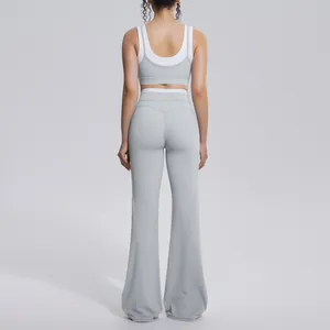 Back view of a two-tone grey yoga set showing the sports bra and flared leggings fit.