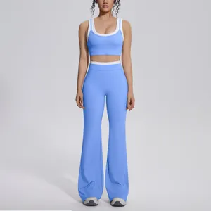 Stylish blue two-piece yoga set featuring contrast sports bra and high-waist flare leggings