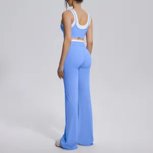 Side view of a premium blue color block yoga set featuring a sports bra and high waist flare pants