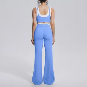 Detailed back view of blue ribbed yoga set with high-waisted flare pants and bra