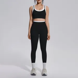 Professional black and white contrast yoga set with high waist leggings and sports bra