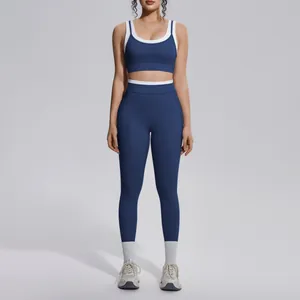 Full body view of navy and white contrast color high-waisted yoga bra and leggings set.